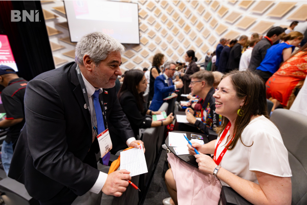 BNI Members exchanging referrals in a chapter meeting