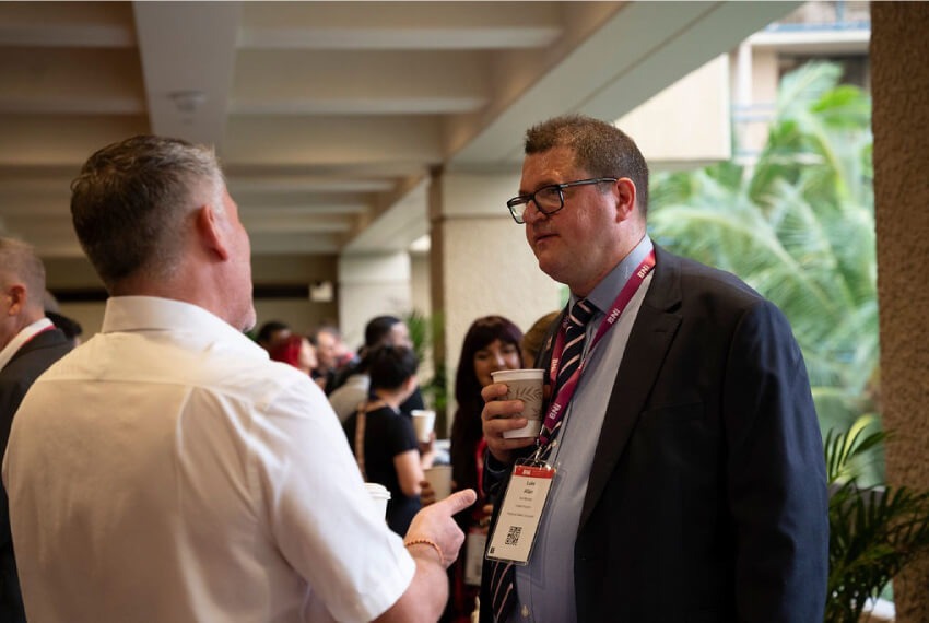Small business owners discussing at a conference