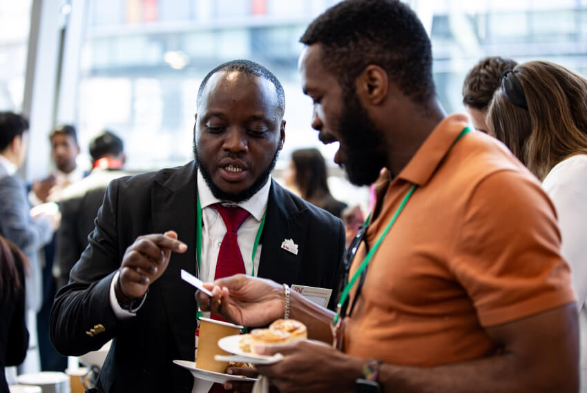 BNI members discussing a referral opportunity during a business networking meeting