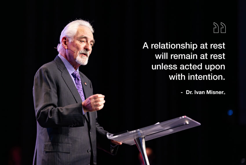 Dr Ivan Misner delivering a networking keynote including a quote about intention in relationships