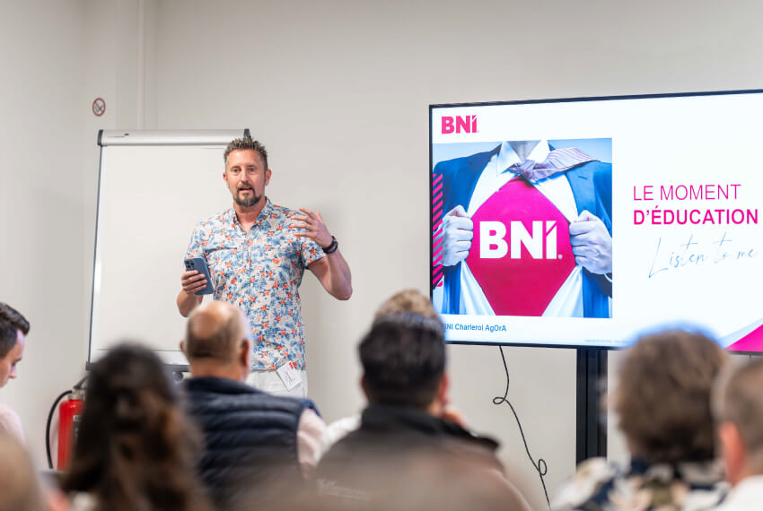A BNI member delivering an education moment presentation during a weekly networking meeting