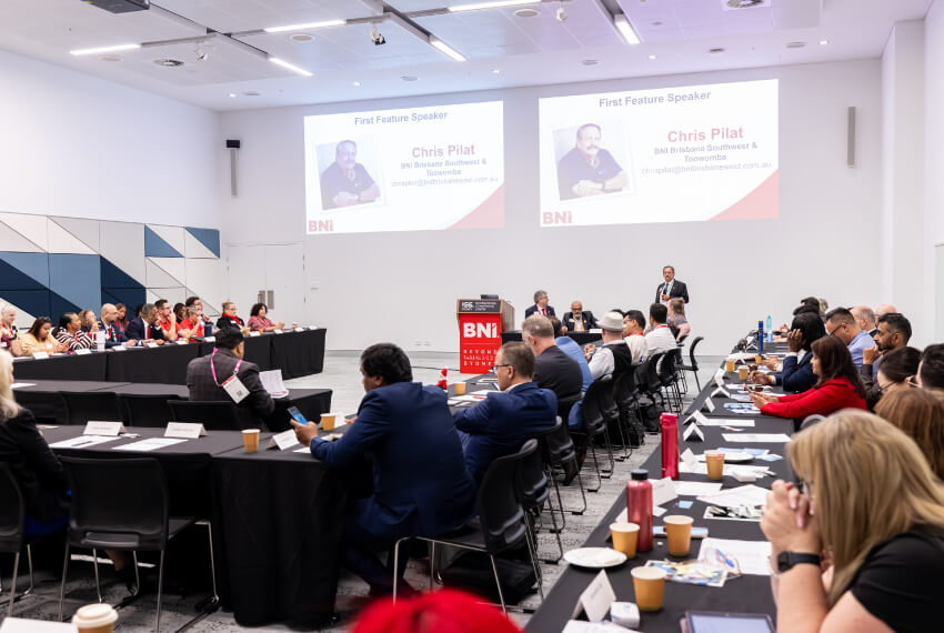 Business professionals attending a BNI networking conference 